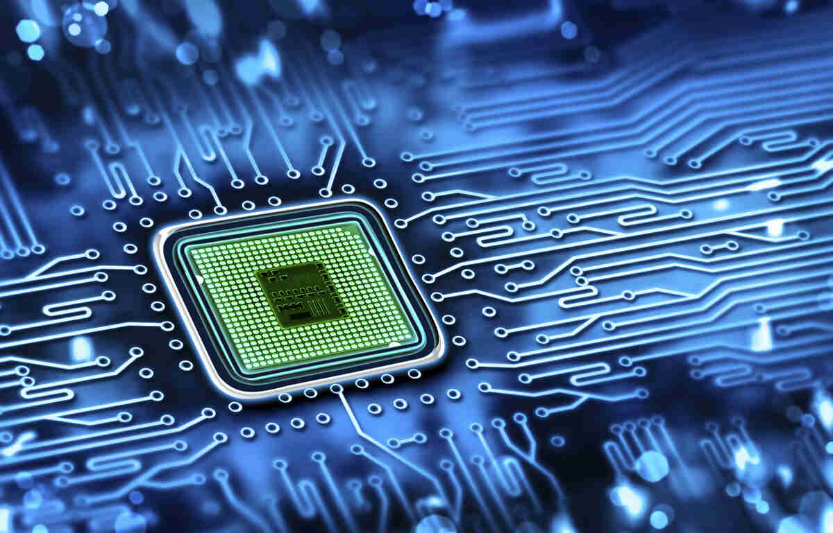 Close-up of a microchip integrated on a computer motherboard, surrounded by circuitry