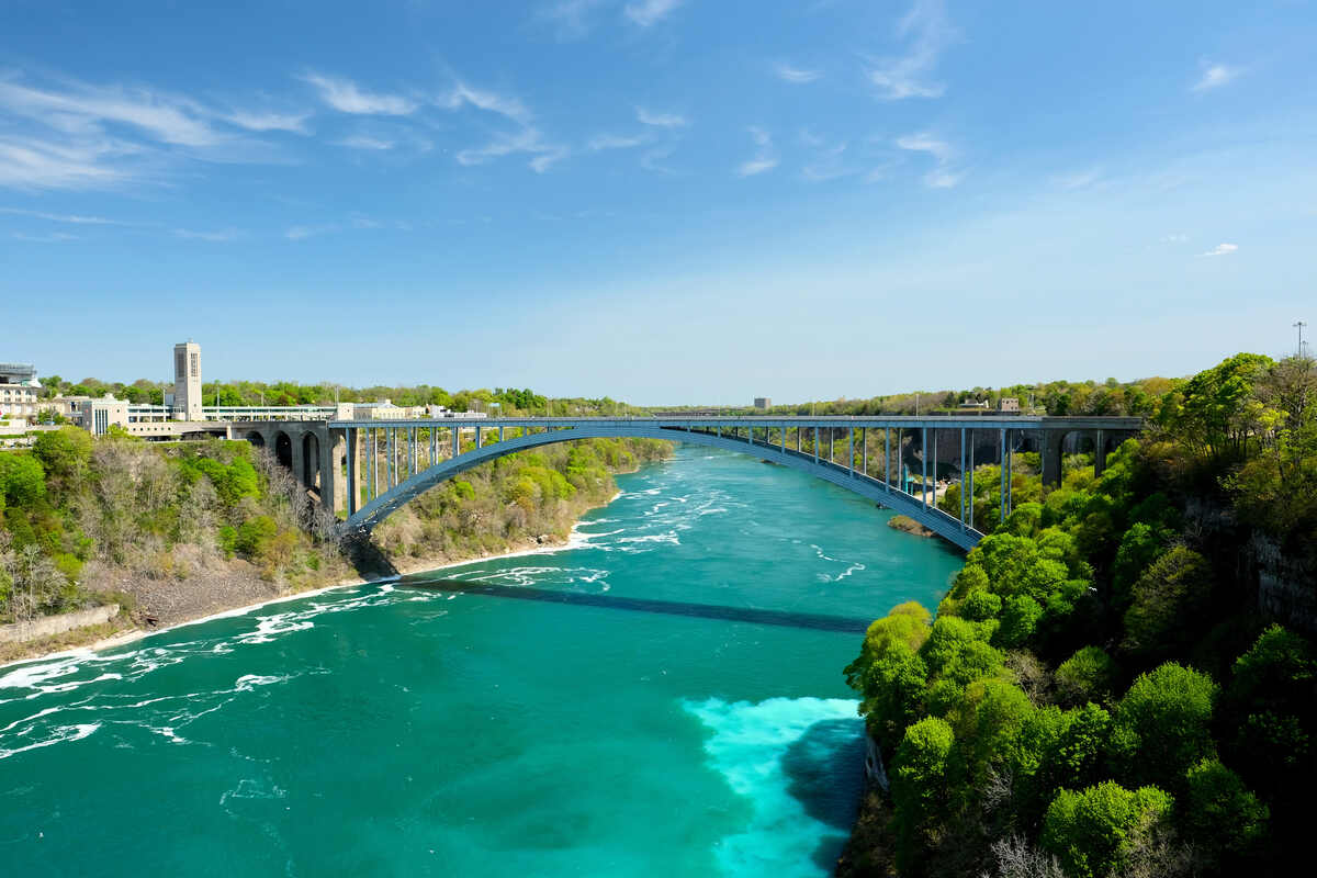 The Rainbow Bridge majestically spanning the Niagara Gorge, serving as a Canada-USA border crossing.