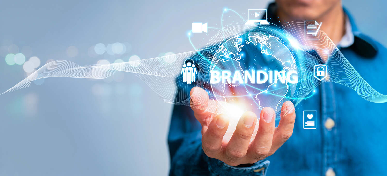Concept image of a man holding a globe with the word 'Branding', surrounded by various icons representing marketing channels.