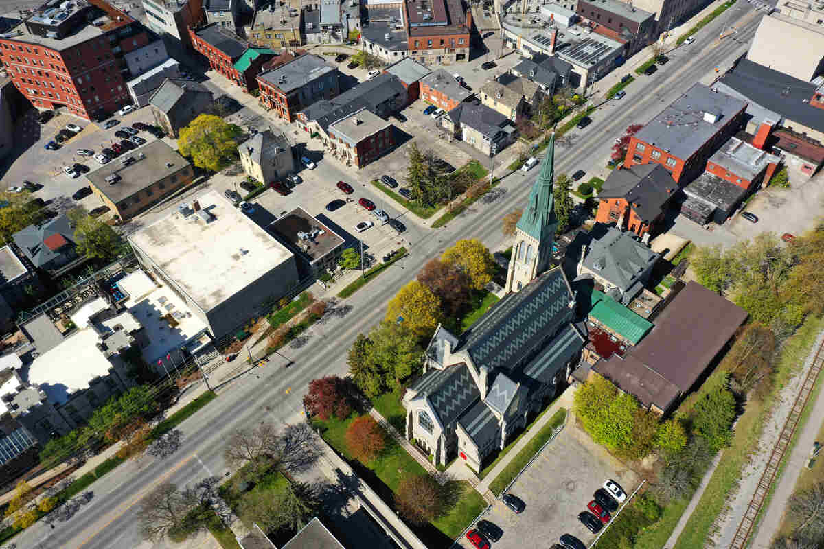 An aerial view of downtown Guelph, Ontario, showing St. George's Anglican Church and surrounding buildings.