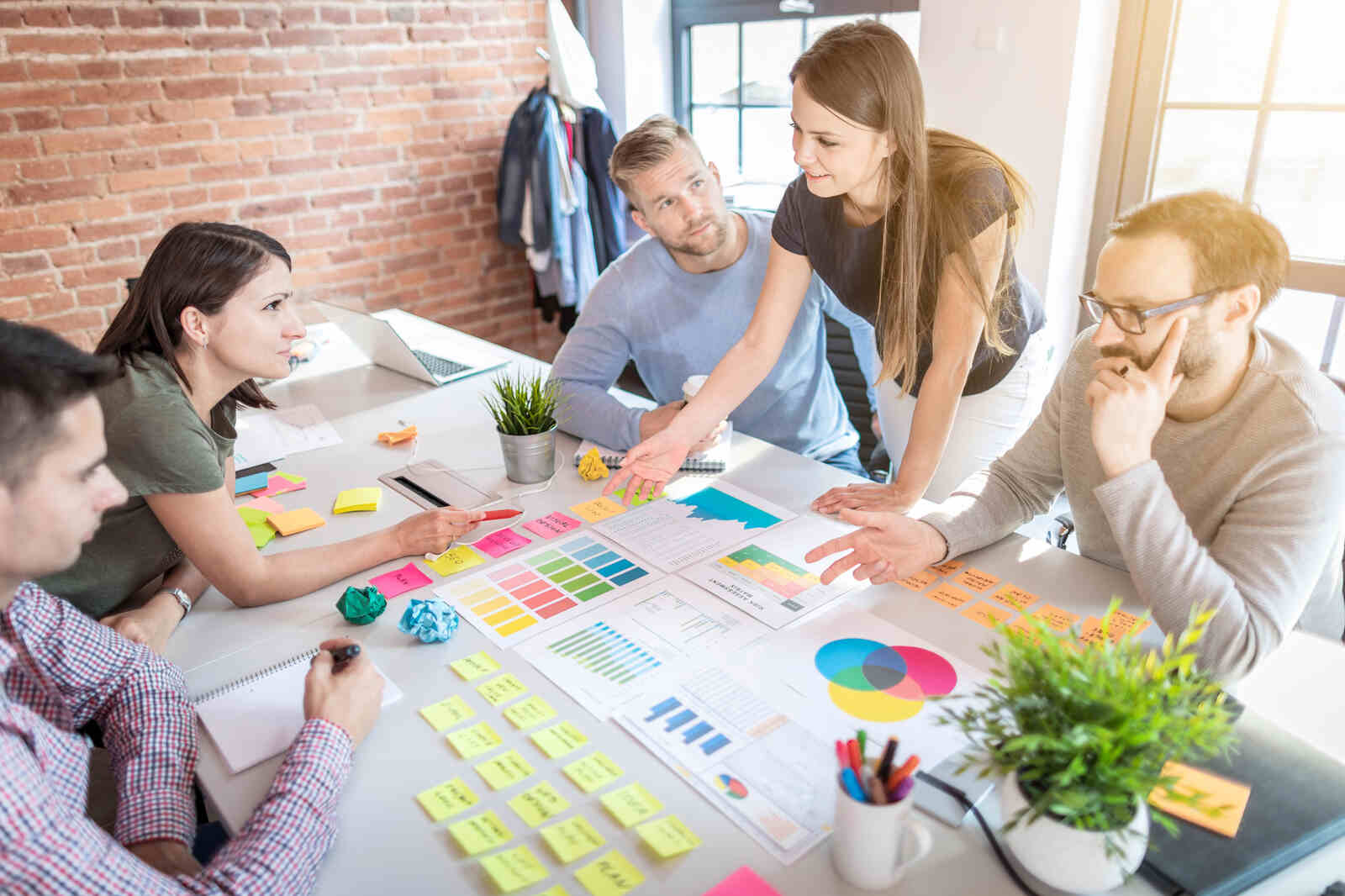 A legal marketing team reviews a law firm growth strategy together in a modern Canadian office