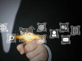 Concept image: close-up of a lawyer pointing to a floating 'SEO' button, hovering in the air amongst various other website icons.